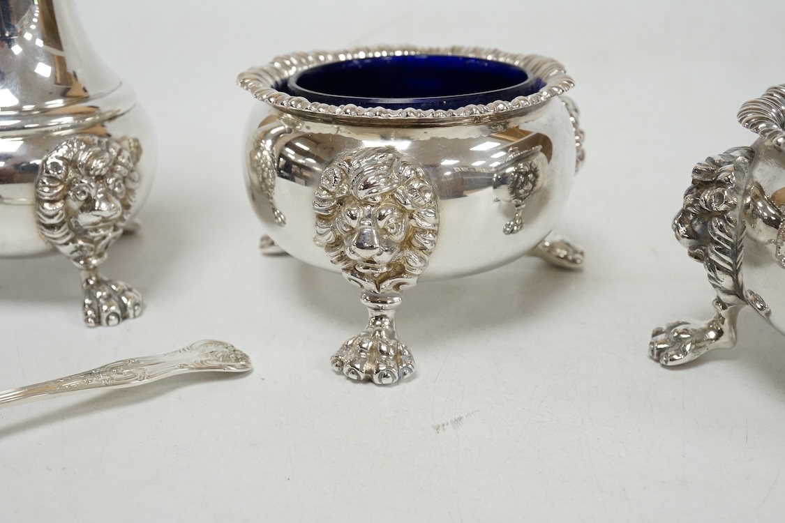 A George VI silver three piece condiment set by Mappin & Webb, London, 1937, with blue glass liners, one associated, pepper, 13.9cm, 26.5oz.